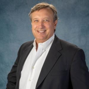 Portrait of Tim Bayer, COO at SDC