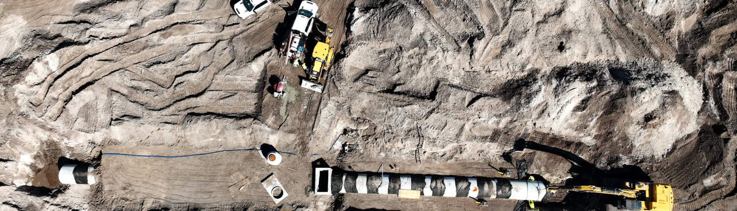 default Heavy construction site with drilling and excavation equipment for site development projects.