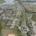 Modern residential neighborhood with well-planned streets and eco-friendly features, showcasing site development, land surveying, and infrastructure construction services for community growth.