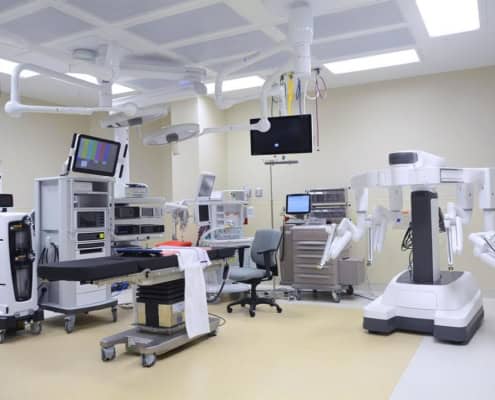 Advanced hospital operating room with surgical robots and medical equipment for site development.
