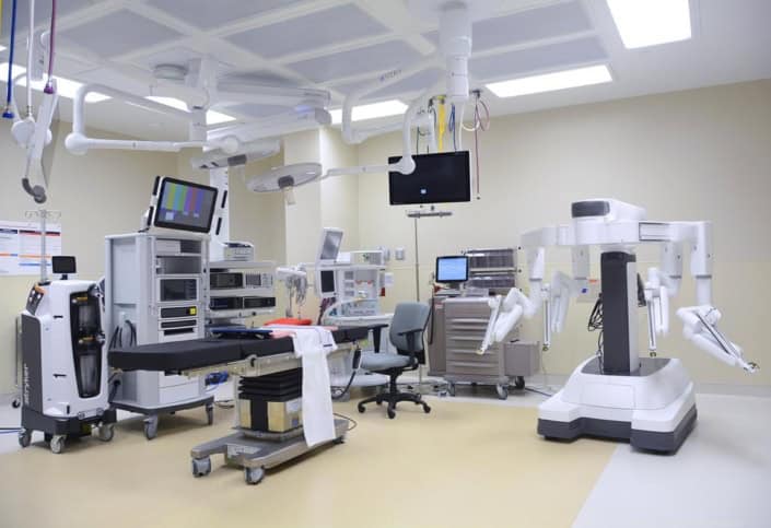 Advanced hospital operating room with surgical robots and medical equipment for site development.