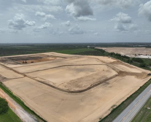Excavation site for commercial development, showcasing site preparation and land grading for future construction projects in Florida.