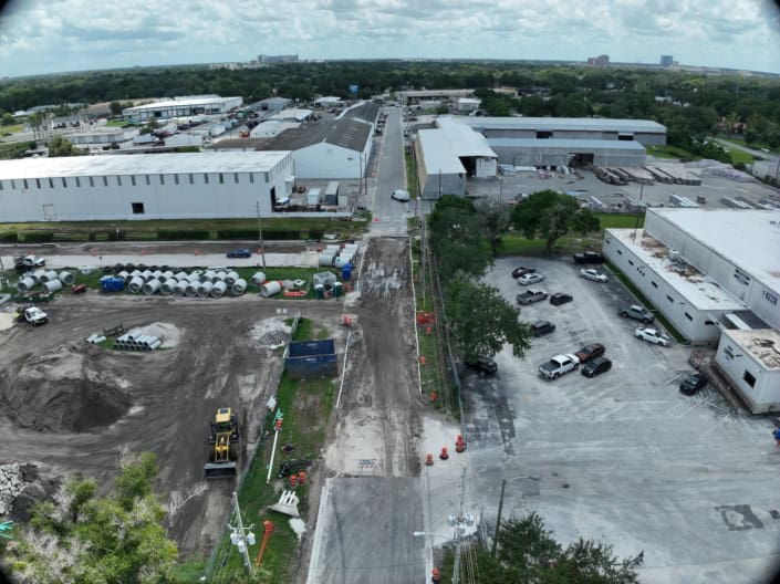 Industrial construction site with ongoing development of warehouse facilities and infrastructure, showcasing site development and commercial building projects.