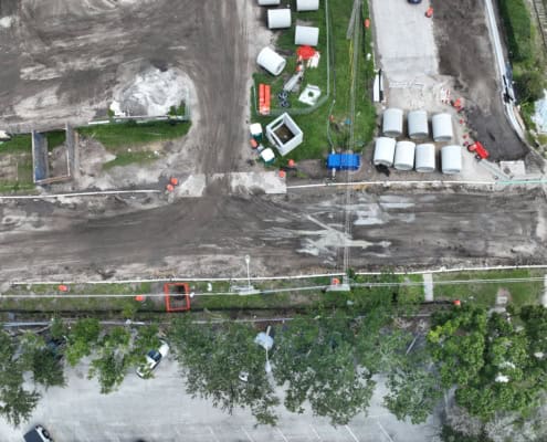 Excavation and site development for infrastructure with construction equipment and materials on a construction site, emphasizing site development services.