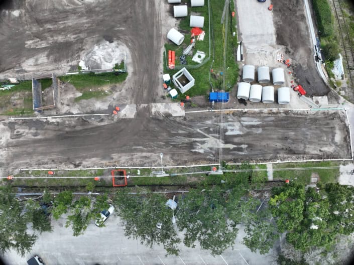 Excavation and site development for infrastructure with construction equipment and materials on a construction site, emphasizing site development services.