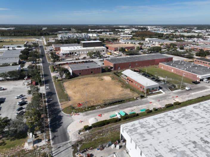 Modern commercial site development in Florida with new construction, infrastructure, and urban planning, emphasizing property development and site planning expertise.