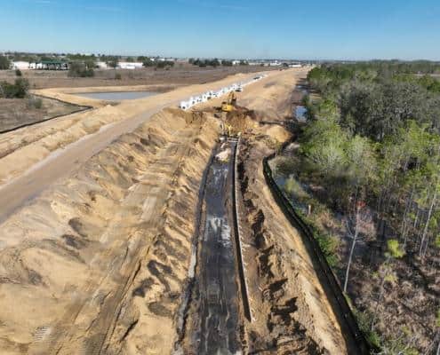 Modern construction site with earthworks and heavy machinery for site development and infrastructure planning.