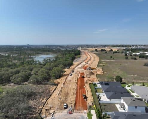 Excavation and site development for new residential community, showcasing land grading and infrastructure preparation for housing construction.
