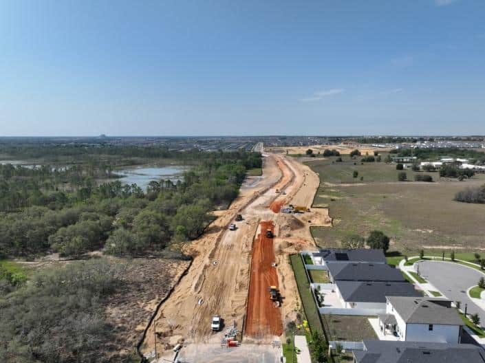Excavation and site development for new residential community, showcasing land grading and infrastructure preparation for housing construction.