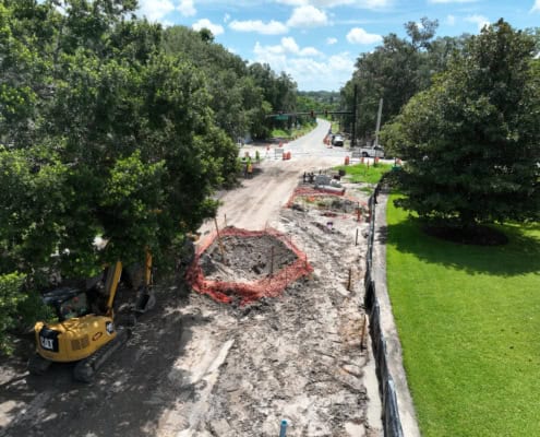 Excavation and road construction work underway for site development in Florida.