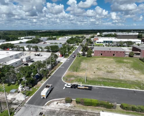 Modern industrial site development with commercial buildings and infrastructure in progress for business growth.