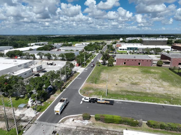 Modern industrial site development with commercial buildings and infrastructure in progress for business growth.