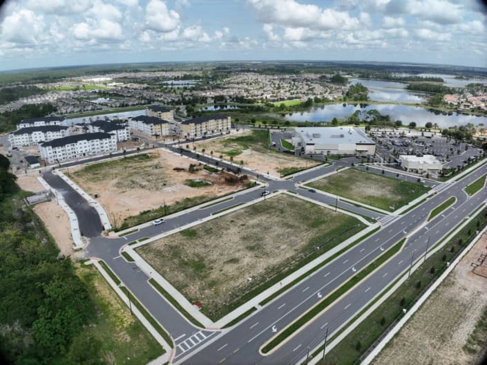 Vacant commercial development lots in a newly planned retail and residential community in Florida.