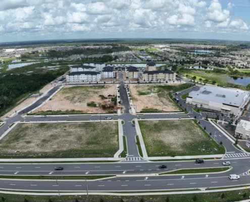 Empty lot development at SDC with new infrastructure and surrounding residential areas.