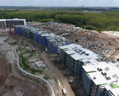 Modern multi-story building construction site with ongoing development activities and advanced infrastructure under development.