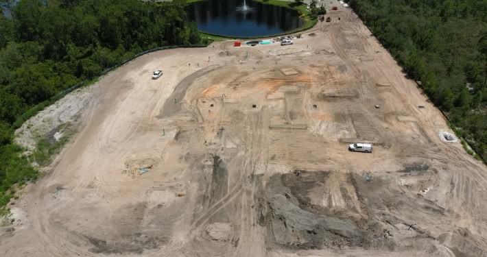 Excavation site for new residential development by SD Construction, showcasing land clearing and foundation preparation for future housing community.