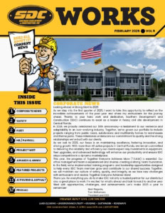 Modern commercial construction site in Central Florida with SDC branding, American flag, and professional office building.